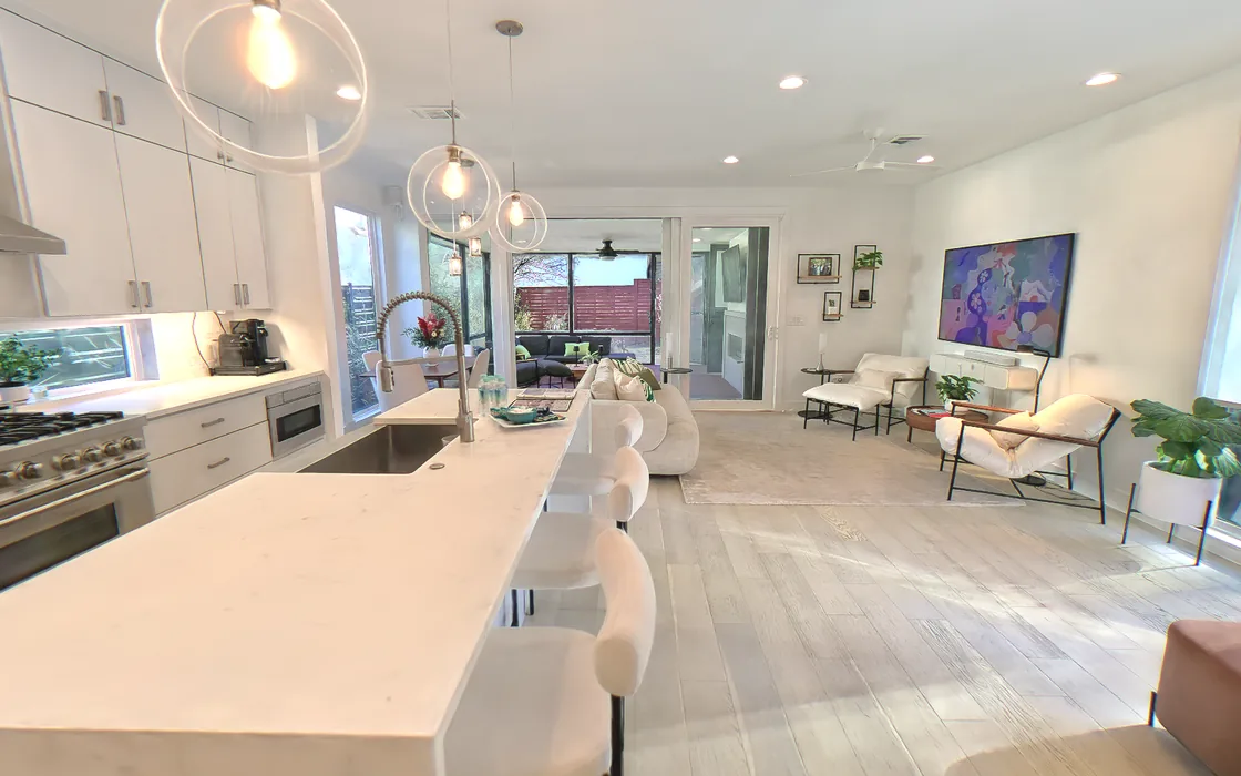 The captured home as the 3D scene first shows it: the kitchen island in front and the living room behind